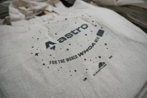 A pale grey Astro totebag with a background of scattered stars with the Astro and Cloudflare logos. For the world WHOA web