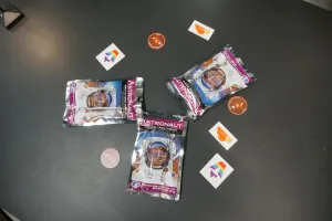 Single serve packages of astronaut ice cream surrounded by various Astro and Cloudflare stickers